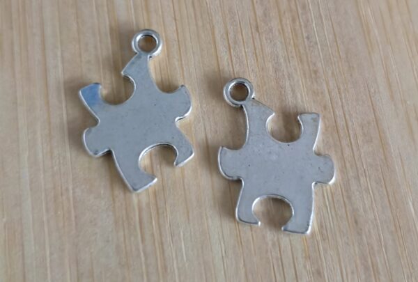 bedel puzzelstuk zilver 20 mm x 14 mm 2 stuks